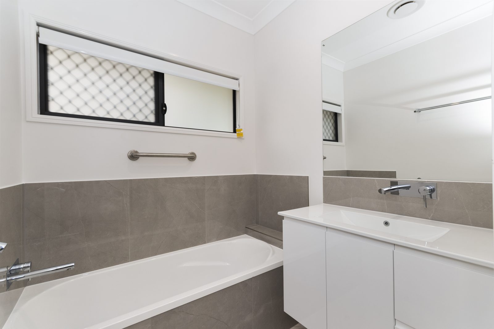 Main bathroom with stone tiling in a Townsville home