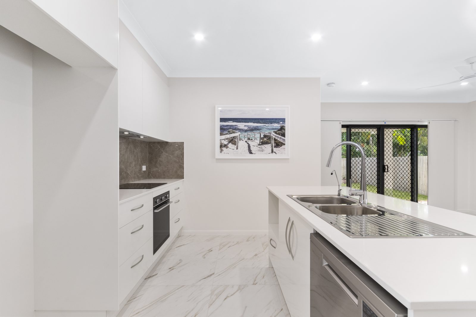 Modern kitchen with stone benchtops in a Townsville home